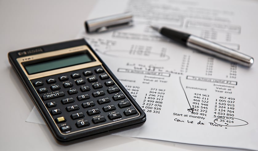 Canva - Black Calculator Near Ballpoint Pen on White Printed Paper