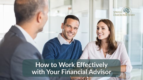 Financial planner and couple reviewing strategy together.