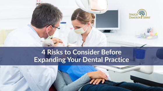 Dentist evaluating financial projections for practice expansion