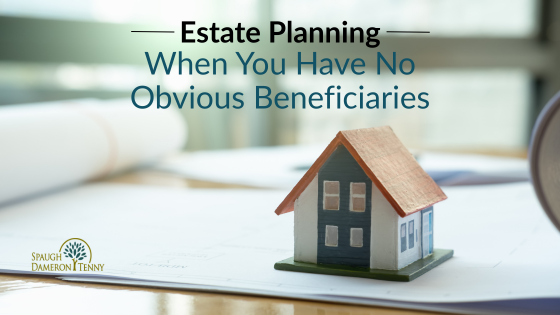 Estate planning when you have no obvious beneficiaries: a small model house sits on documents on a desk. Spaugh Dameron Tenny logo. [Estate Planning When You Have No Obvious Beneficiaries.png]