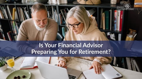 Couple reviewing retirement planning documents together at home.