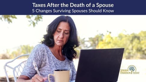 Surviving spouse reviewing financial and tax documents with a financial planner