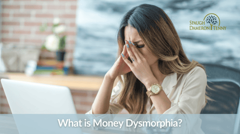 Individual reviewing finances while reflecting on comparison, lifestyle pressure, and financial confidence.